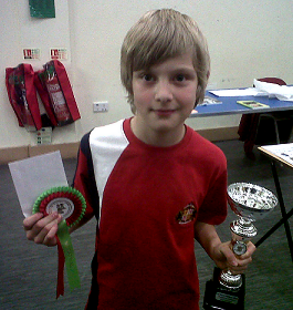 Winner Jake Holton from Witney Chess Club with his Megafinal trophies